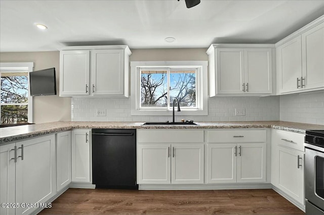 kitchen featuring white cabinets, decorative backsplash, dishwasher, and a sink