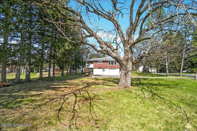 view of yard featuring an attached garage