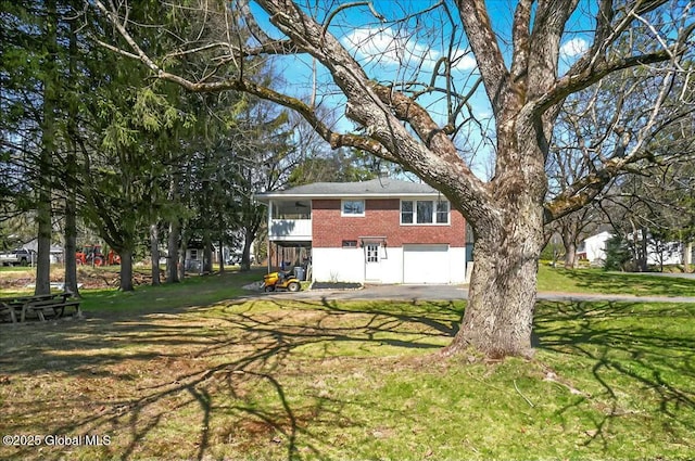 exterior space with an attached garage and aphalt driveway