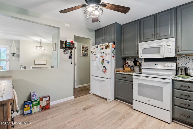 kitchen with white appliances, gray cabinets, ceiling fan, light wood-type flooring, and backsplash