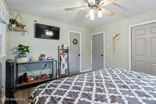 bedroom featuring wood finished floors and ceiling fan