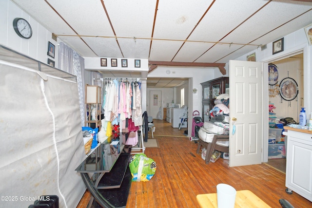 below grade area featuring a drop ceiling and wood finished floors