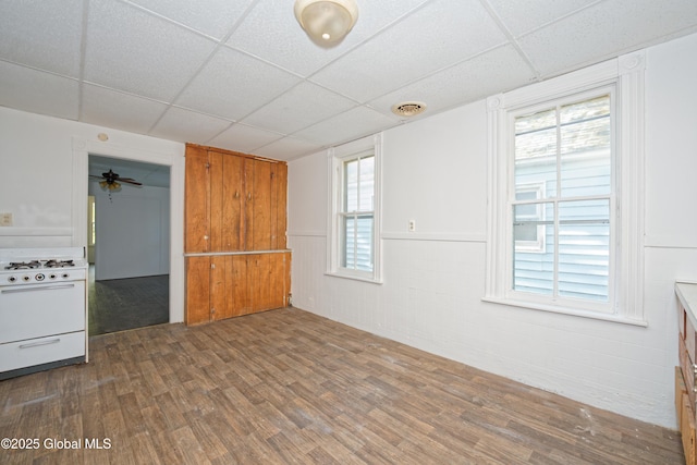 unfurnished room featuring a paneled ceiling, visible vents, and wood finished floors