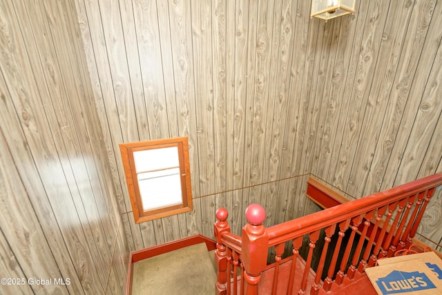 stairway with wood walls