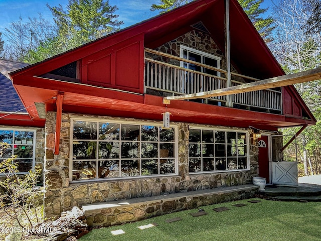 155 Bowen Hill Rd, Thurman, NY 12885 - view of front of house with stone siding, roof with shingles, and a balcony