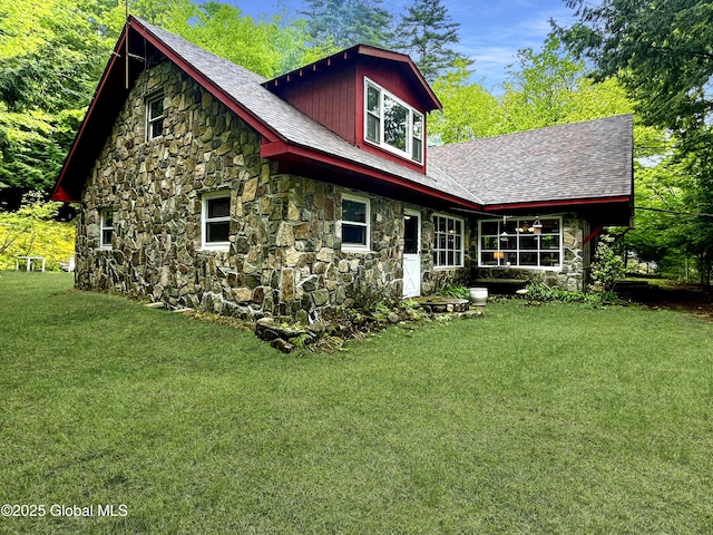 155 Bowen Hill Rd, Thurman, NY 12885 - rear view of house with stone siding, a yard, and a shingled roof