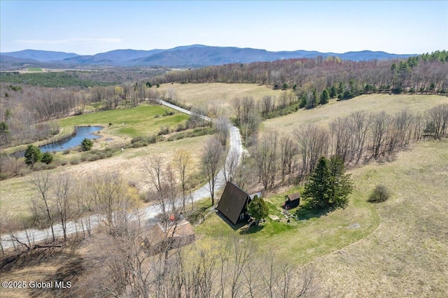 aerial view featuring a rural view and a water and mountain view