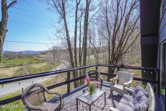 balcony featuring a mountain view