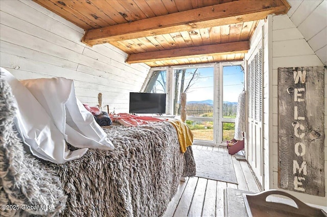 bedroom with wood ceiling, hardwood / wood-style flooring, wood walls, access to outside, and vaulted ceiling with beams