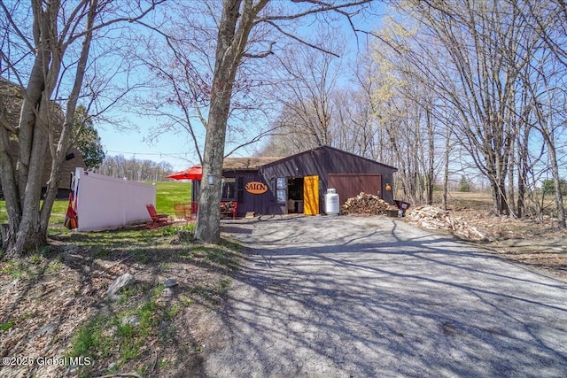 view of outbuilding featuring driveway