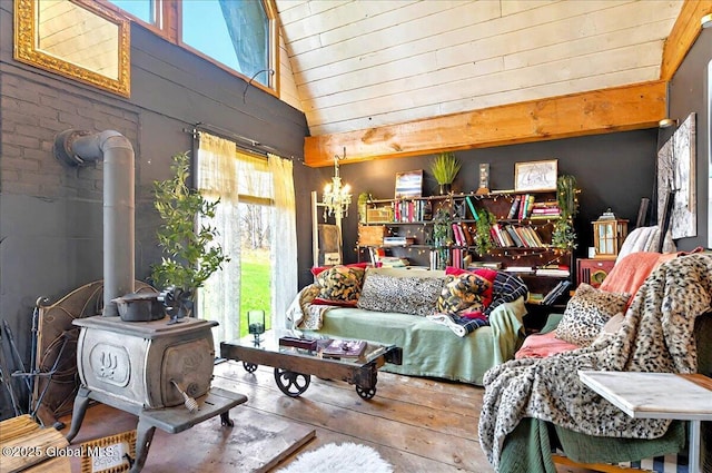 interior space featuring wooden walls, high vaulted ceiling, wood-type flooring, and multiple windows