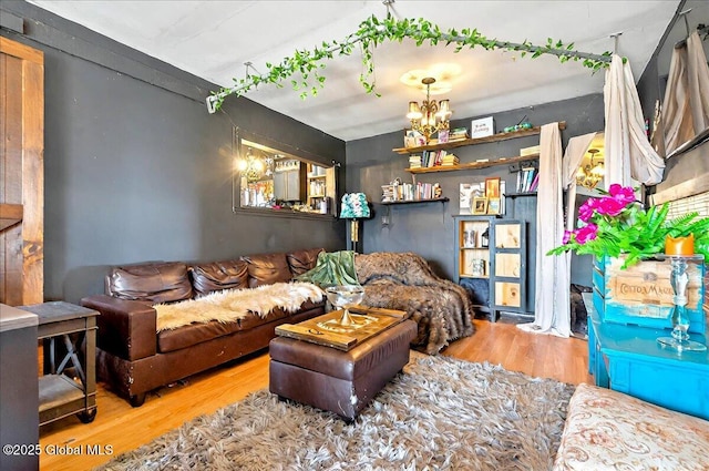 living room featuring a chandelier and wood finished floors