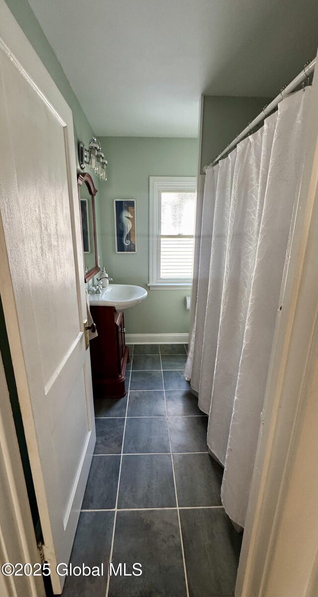 47 Washington Rd, Scotia, NY 12302 - bathroom featuring baseboards, tile patterned floors, and vanity