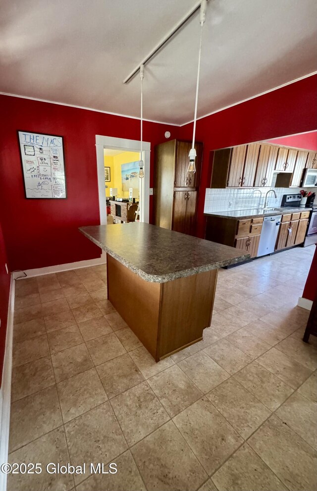 47 Washington Rd, Scotia, NY 12302 - kitchen with a sink, pendant lighting, rail lighting, appliances with stainless steel finishes, and a kitchen island