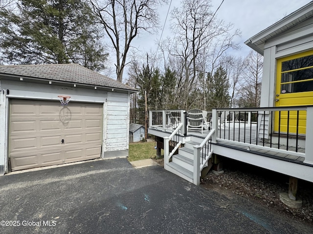 47 Washington Rd, Scotia, NY 12302 - exterior space with driveway, an outdoor structure, a detached garage, and a deck