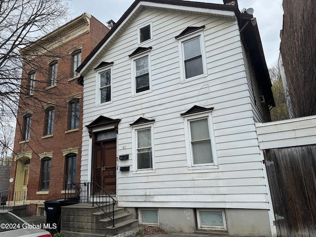 view of front of property featuring fence