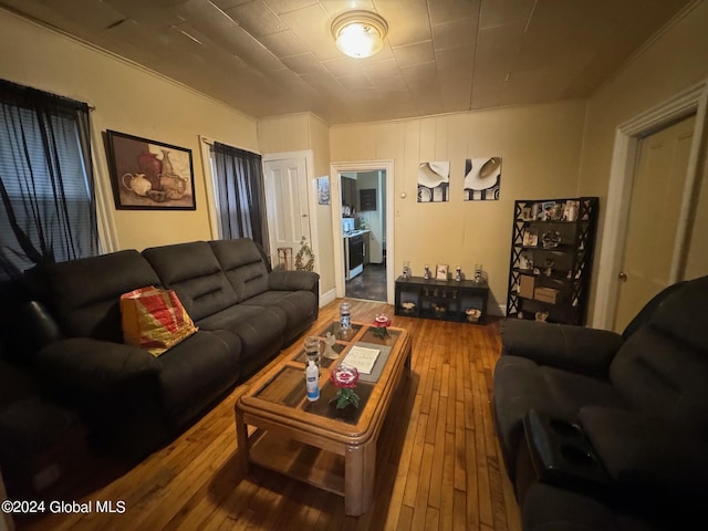 living room featuring ornamental molding and hardwood / wood-style floors