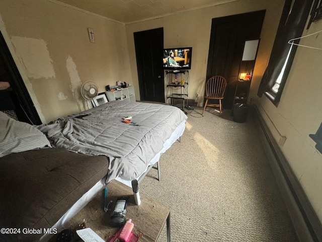 bedroom with carpet and crown molding