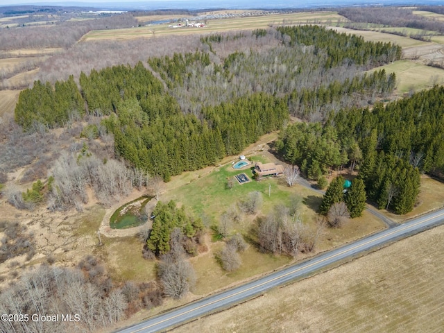 birds eye view of property with a rural view