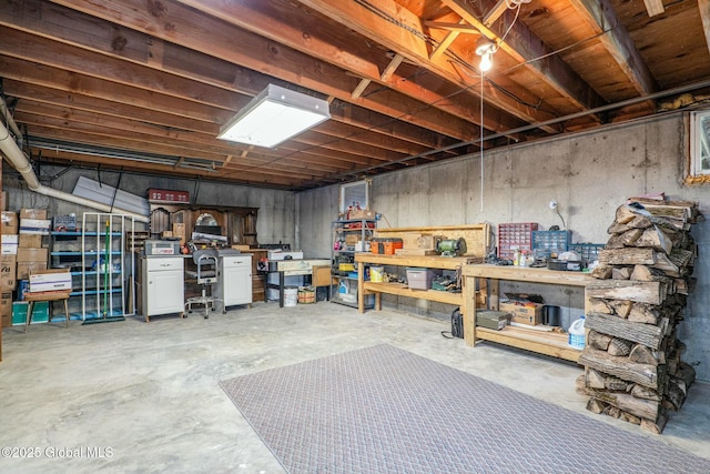 unfinished basement featuring a workshop area