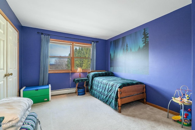 carpeted bedroom featuring baseboards and a baseboard radiator
