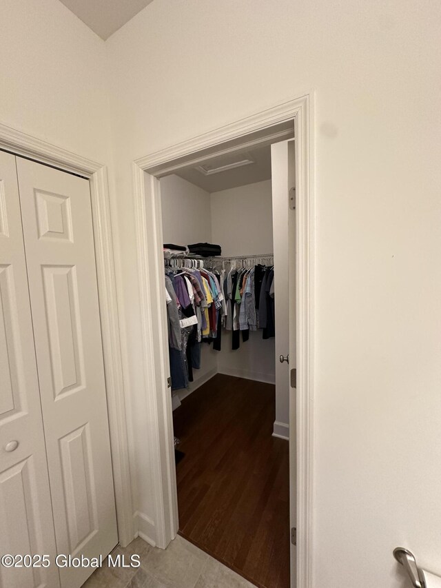 spacious closet with wood finished floors