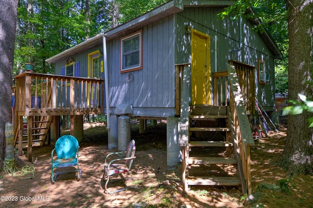 9 E Center St, Day, NY 12835 - view of play area featuring a wooden deck and stairway