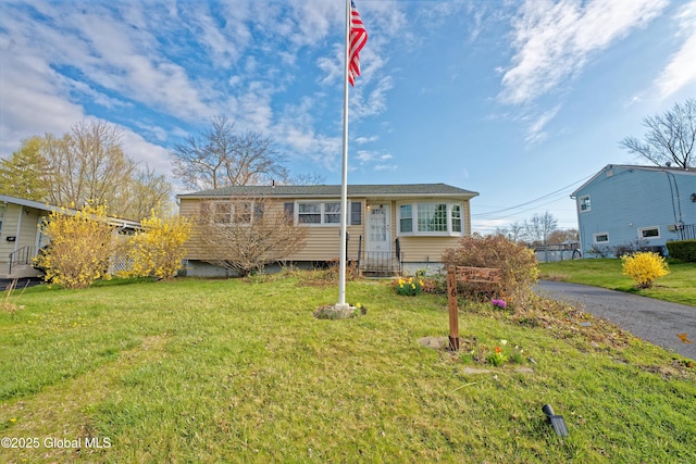 ranch-style house with a front yard