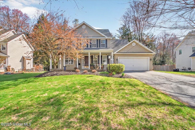craftsman inspired home featuring a garage, aphalt driveway, fence, a front yard, and a porch