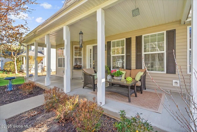 view of patio / terrace featuring a porch and an outdoor living space