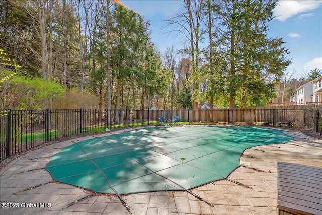 view of pool with fence, a fenced in pool, and a patio area