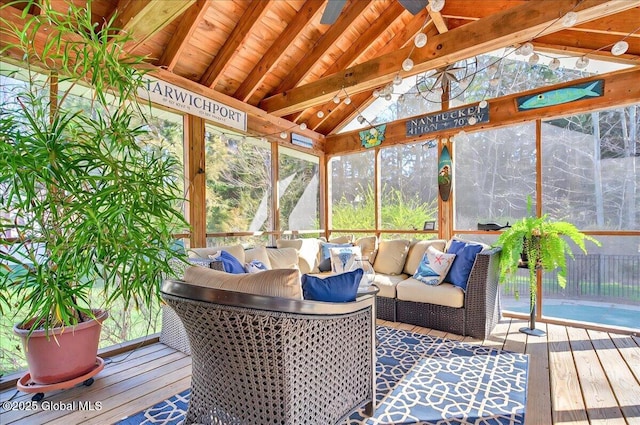 sunroom / solarium with beamed ceiling and outdoor lounge area