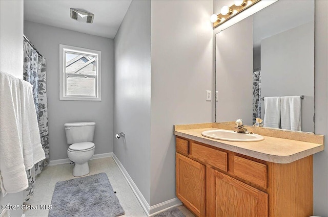 bathroom featuring toilet, baseboards, visible vents, and vanity