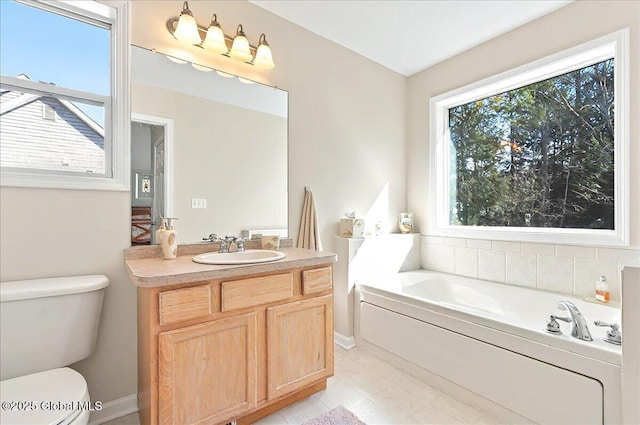 bathroom with a garden tub, tile patterned flooring, toilet, and vanity