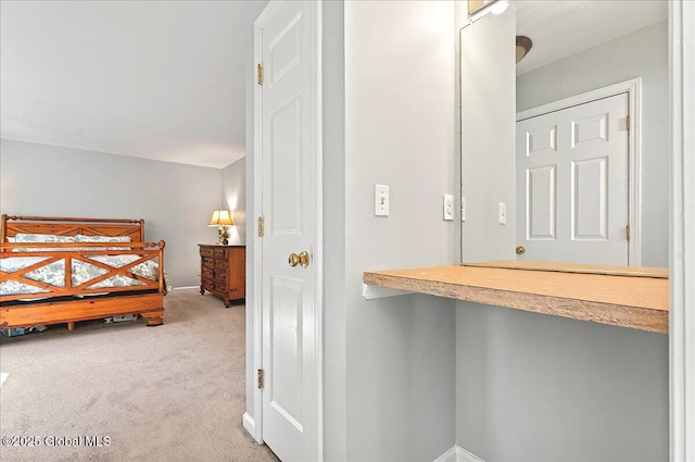 carpeted bedroom featuring baseboards