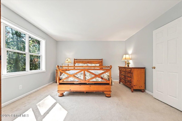 carpeted bedroom with baseboards