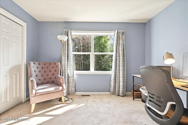 carpeted office featuring baseboards and visible vents