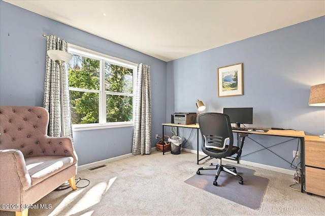 office area with visible vents, carpet, and baseboards