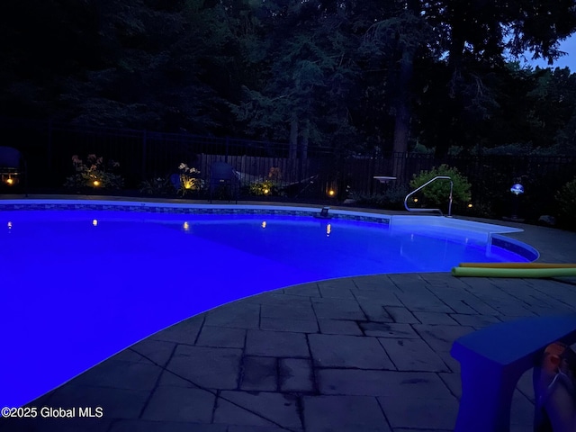 view of swimming pool featuring a patio, a fenced in pool, and a fenced backyard