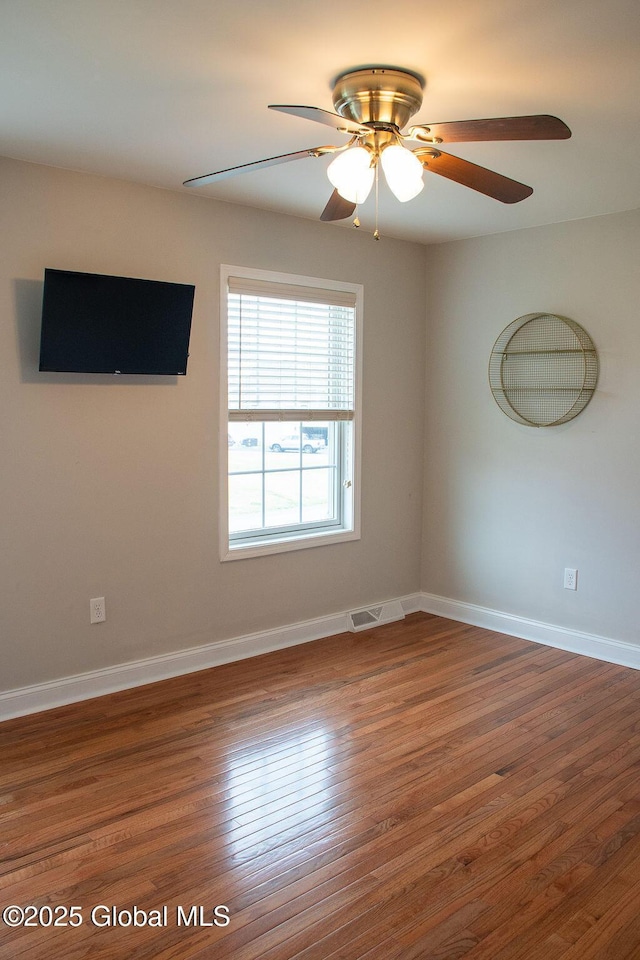 20 Fort Vaux Ln, Colonie, NY 12189 - unfurnished room with wood finished floors, ceiling fan, and baseboards