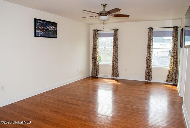 20 Fort Vaux Ln, Colonie, NY 12189 - unfurnished room featuring ceiling fan, wood finished floors, and baseboards
