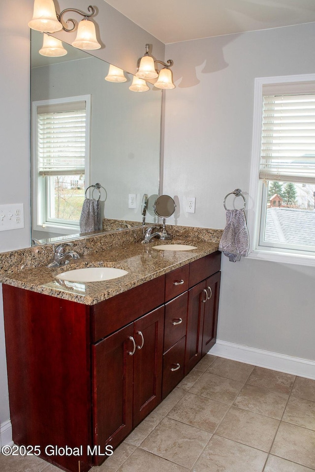 20 Fort Vaux Ln, Colonie, NY 12189 - bathroom featuring double vanity, baseboards, and tile patterned flooring