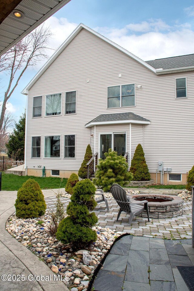 20 Fort Vaux Ln, Colonie, NY 12189 - back of property featuring an outdoor fire pit and a patio