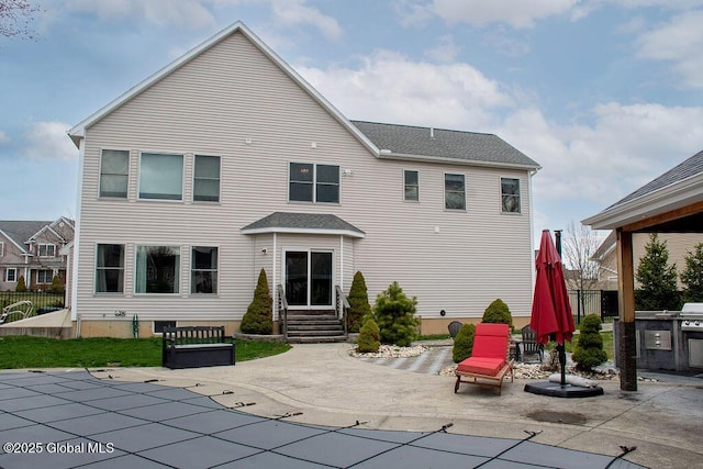 20 Fort Vaux Ln, Colonie, NY 12189 - rear view of house with a patio, a covered pool, and entry steps