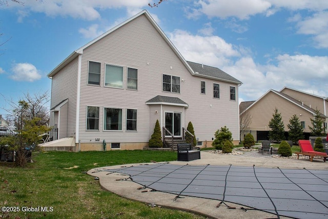 20 Fort Vaux Ln, Colonie, NY 12189 - back of property with entry steps, a patio, a lawn, and a covered pool