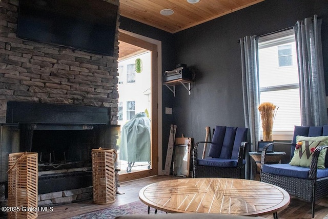 20 Fort Vaux Ln, Colonie, NY 12189 - living room featuring wood ceiling, wood finished floors, and exterior fireplace