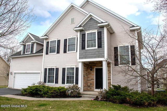 20 Fort Vaux Ln, Colonie, NY 12189 - view of front of property featuring a garage, stone siding, and asphalt driveway