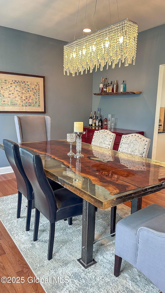 20 Fort Vaux Ln, Colonie, NY 12189 - dining space with wood finished floors, a chandelier, and a dry bar