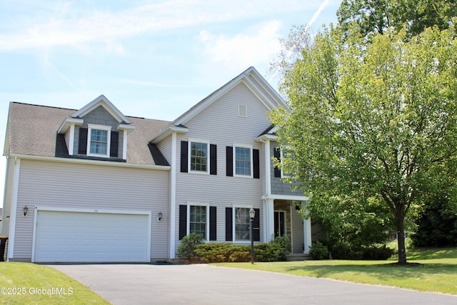 20 Fort Vaux Ln, Colonie, NY 12189 - view of front of home with concrete driveway, a front lawn, and an attached garage