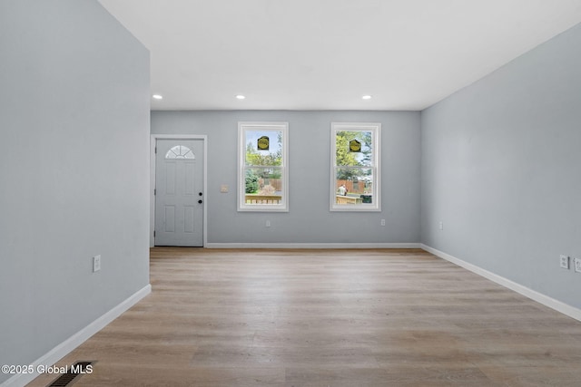 111 Mann Ave, Troy, NY 12180 - unfurnished living room featuring recessed lighting, baseboards, and wood finished floors